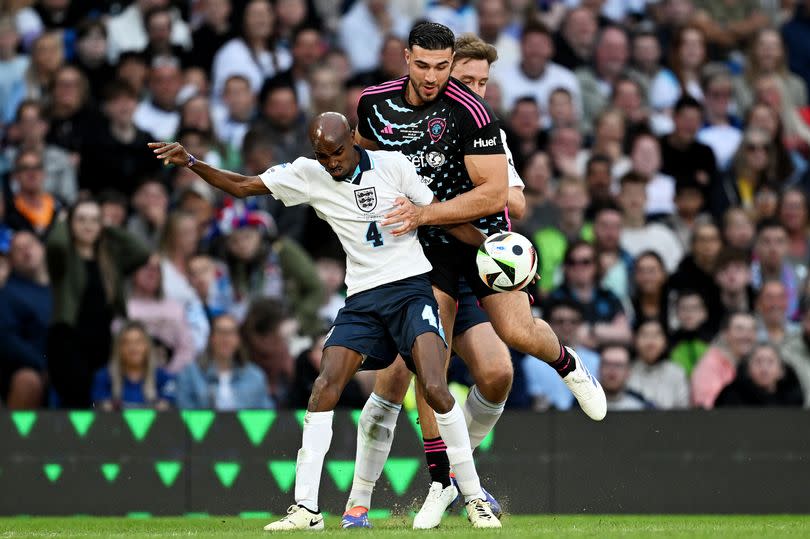 Tommy Fury is in action for the World XI during Soccer Aid