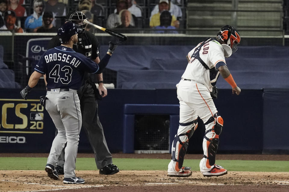 Houston Astros catcher Martin Maldonado reacts after Tampa Bay Rays' Michael Brosseau struck out with bases loaded during the sixth inning in Game 4 of a baseball American League Championship Series, Wednesday, Oct. 14, 2020, in San Diego. (AP Photo/Jae C. Hong)