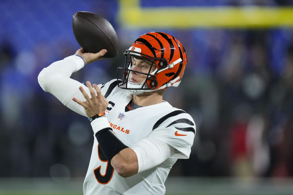 Cincinnati Bengals quarterback Joe Burrow (9) pass the ball during warmups before an NFL football game against the Baltimore Ravens in Baltimore, Thursday, Nov. 16, 2023. (AP Photo/Matt Rourke)