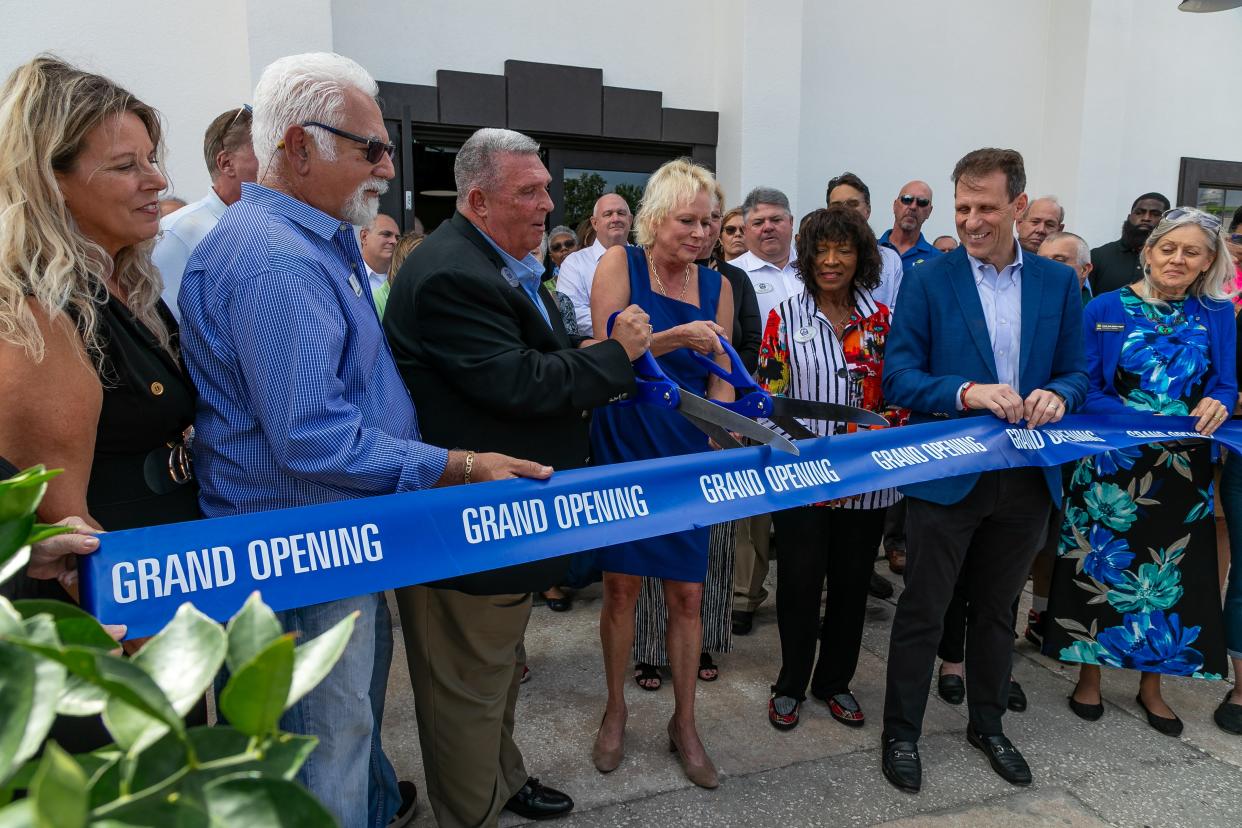 From left, Pam Rivas and George Asbate of Mega Properties, Eustis Mayor Michael Holland, Lake County Commissioner Leslie Campione, City Commissioner Nan Cobb, Vice Mayor Emily Lee, and UCF Business Incubation Program’s Rob Panpeinto cut the ribbon for the grand opening of the UCF Business Incubator/Mega Workplace in Eustis. Commissioner Gary Ashcraft was also in attendance.