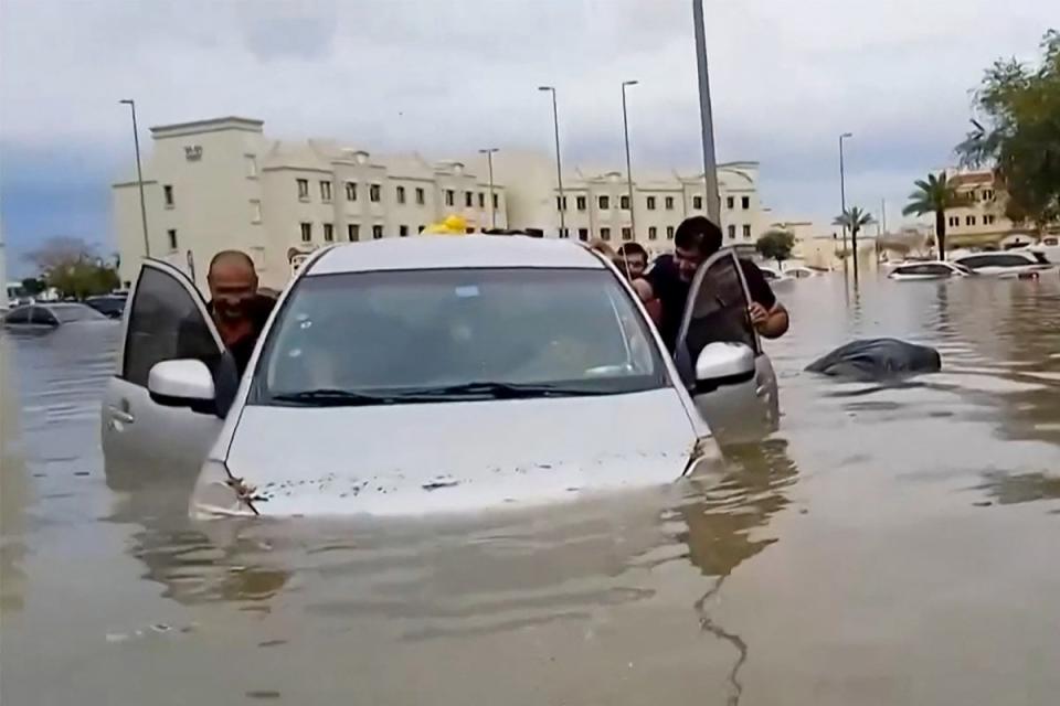 Severe flooding in Dubai caused chaos on the road and forced many businesses to close (AFP/Getty)