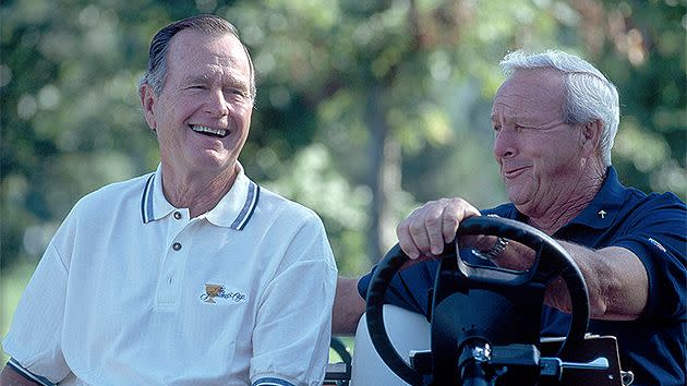 Former US President George Bush with Palmer at the Presidents Cup. Pic: Getty