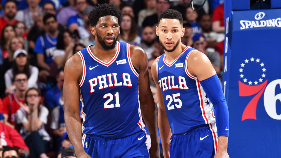 Joel Embiid #21 and Ben Simmons #25 of the Philadelphia 76ers look on during a game against the Brooklyn Nets during Round One Game Five of the 2019 NBA Playoffs on April 23, 2019 at the Wells Fargo Center in Philadelphia. (Photo by Jesse D. Garrabrant/NBAE via Getty Images)