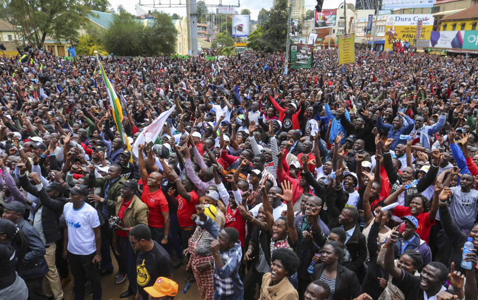 Thousands of Kenyans come out into the streets to celebrate Eliud Kipchoge's sub-2 hour marathon time, in the Rift Valley town of Eldoret where he lives and trains, in Kenya Saturday, Oct. 12, 2019. Eliud Kipchoge sent shockwaves through the world of sport by becoming the first athlete to break the two-hour barrier for a marathon, at an event set up for the attempt in Austria, although it will not count as a world record. (AP Photo)