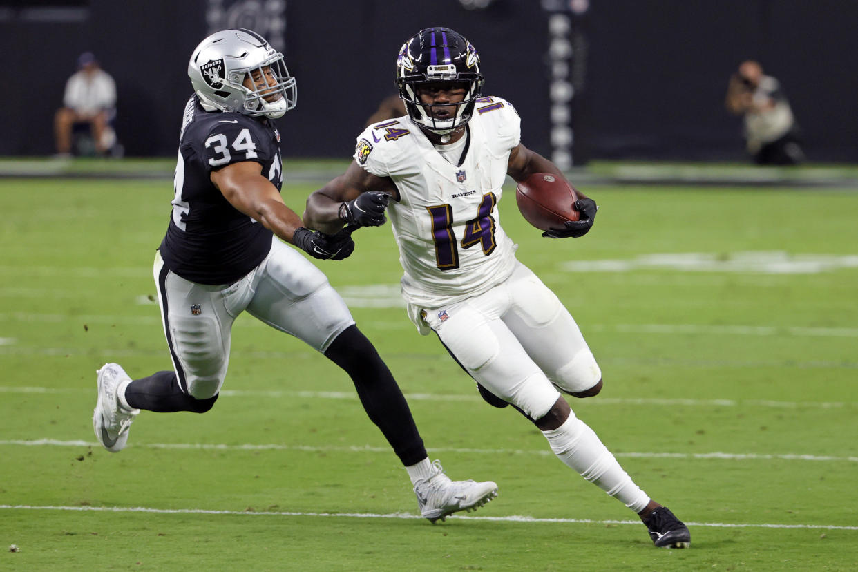LAS VEGAS, NEVADA - SEPTEMBER 13: Sammy Watkins #14 of the Baltimore Ravens runs for yardage after catching a pass against past K.J. Wright #34 of the Las Vegas Raiders at Allegiant Stadium on September 13, 2021 in Las Vegas, Nevada. (Photo by Ethan Miller/Getty Images)