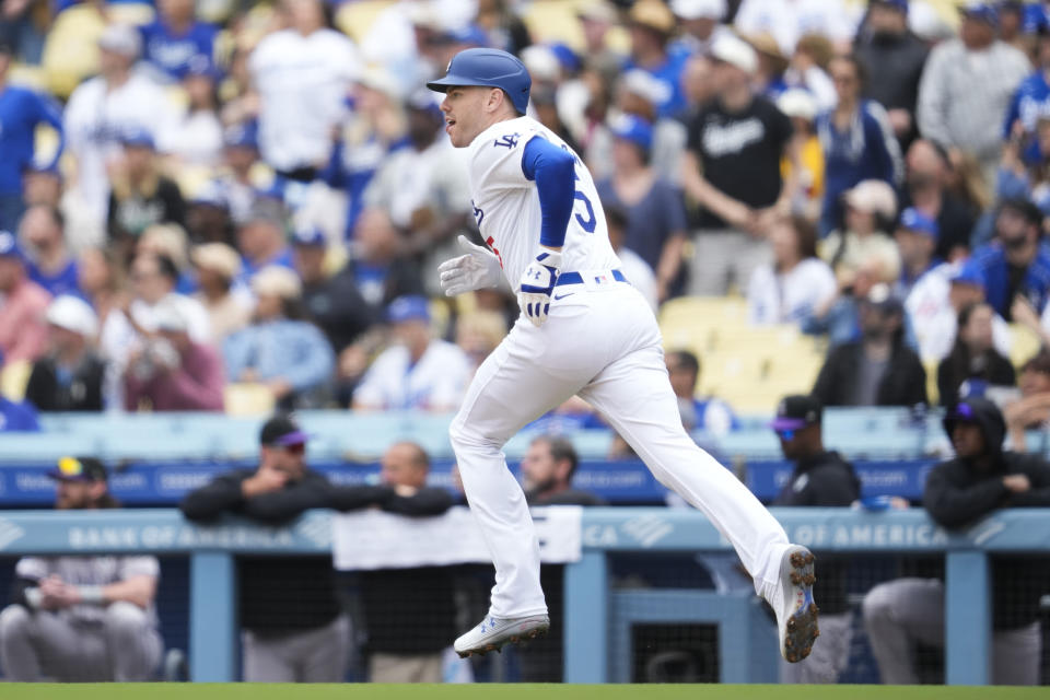 Los Angeles Dodgers' Freddie Freeman runs the bases after hitting a home run during the first inning of a baseball game against the Colorado Rockies in Los Angeles, Sunday, June 2, 2024. (AP Photo/Ashley Landis)