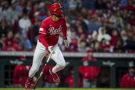 Cincinnati Reds' Will Benson watches his RBI single during the sixth inning of the team's baseball game against the Philadelphia Phillies in Cincinnati, Wednesday, April 24, 2024. (AP Photo/Aaron Doster)