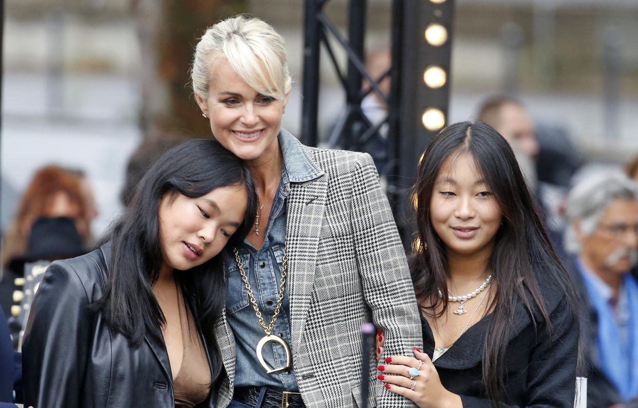 PARIS, FRANCE - SEPTEMBER 14: Laeticia Hallyday (C), widow of late French singer Johnny Hallyday, their daughters Jade and Joy attend the inauguration of the Johnny Hallyday esplanade on September 14, 2021 in Paris, France. Johnny Hallyday died on the night of Tuesday 5 to Wednesday 6 December 2017 at the age of 74. (Photo by Chesnot/Getty Images)