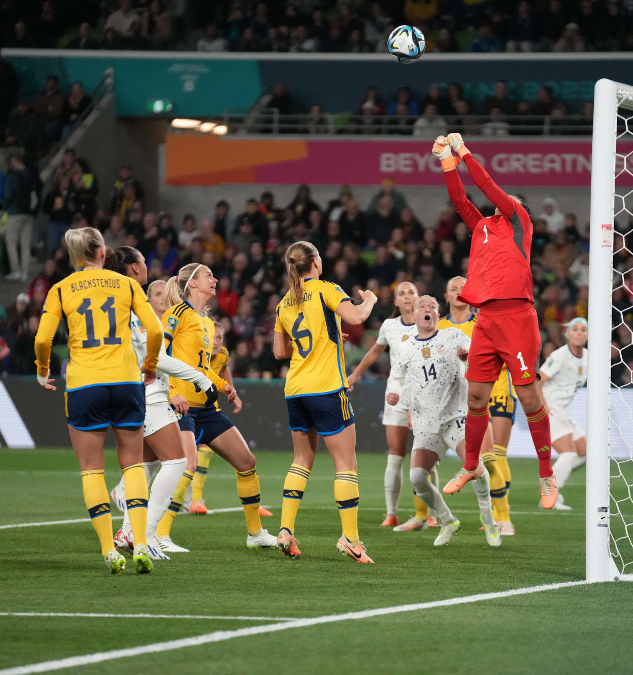 Sweden goalkeeper Zecira Musovic jumps straight up in the air to punch away a shot by the USA in the second half of a Round of 16 match on Aug. 6, which Sweden won.