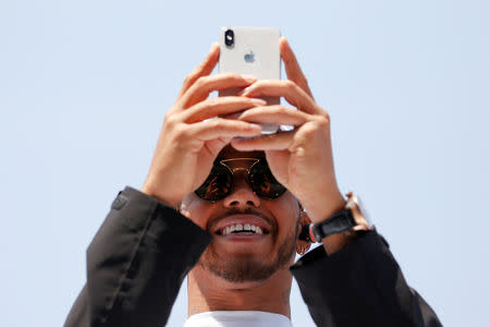 FILE PHOTO: Mercedes' Lewis Hamilton before the Chinese Grand Prix - Shanghai, China - April 15, 2018. REUTERS/Aly Song/File Photo