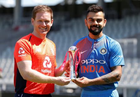 Cricket - England Nets - Emirates Old Trafford, Manchester, Britain - July 2, 2018 England's Eoin Morgan and India's Virat Kohli pose with the series trophy Action Images via Reuters/Ed Sykes