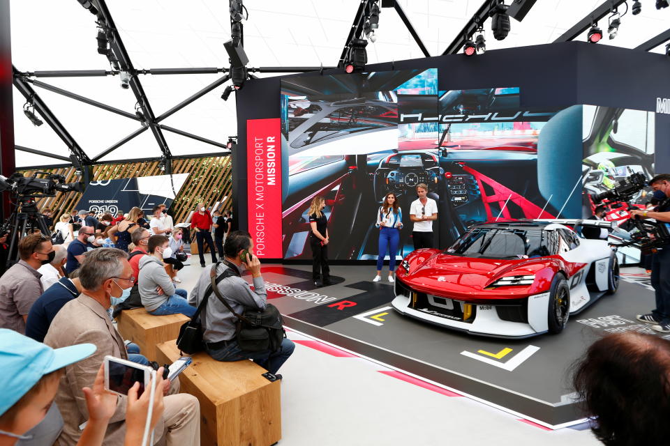 People look at a Porsche Mission R during the Munich Auto Show, IAA Mobility 2021 in Munich, Germany, September 8, 2021. REUTERS/Michaela Rehle