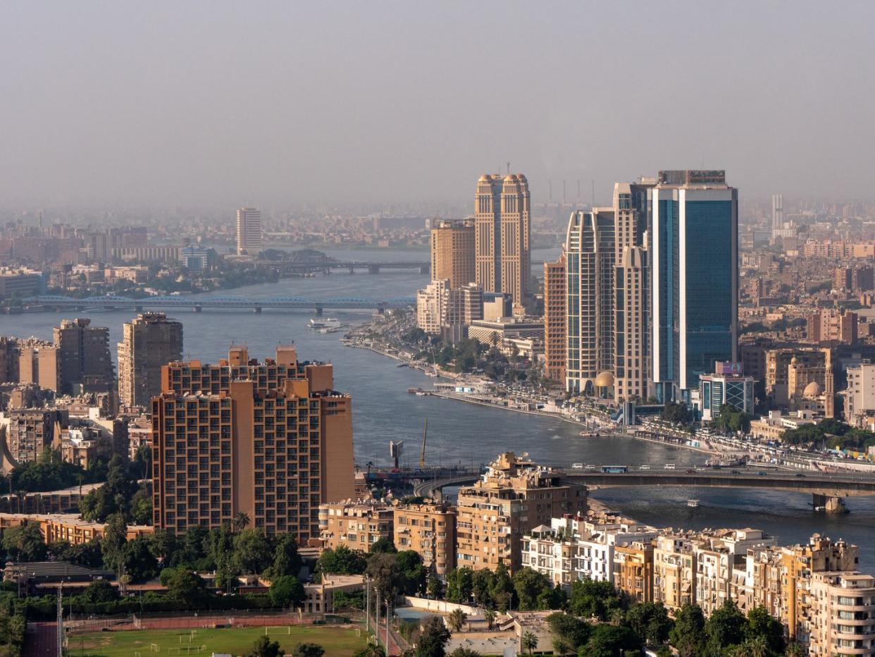 high angle view of downtown cairo during rush hour at 6 october bridge with cars in traffic jams on highways as commuters try to get home after work