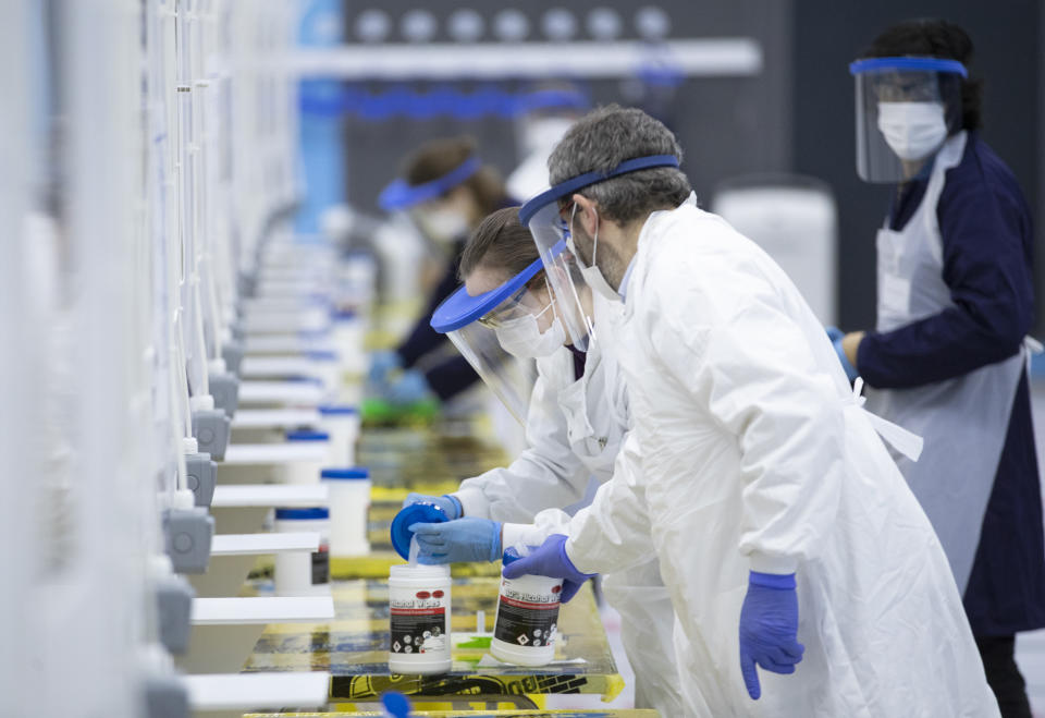 Second year medical students work at a Covid-19 mass testing centre set up at the sports centre at St Andrews University, ahead of the Christmas holiday. (Photo by Jane Barlow/PA Images via Getty Images)