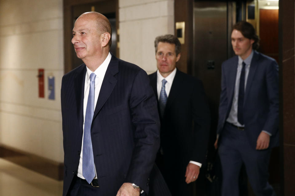 US Ambassador to the European Union Gordon Sondland, left, walks to a secure area of the Capitol to testify as part of the House impeachment inquiry into President Donald Trump, Monday, Oct. 28, 2019, in Washington. (AP Photo/Patrick Semansky)