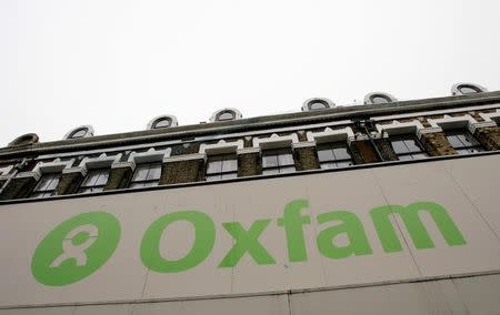 The Oxfam logo is seen on a signage outside a store in Dalston in east London, Britain November 28, 2008. REUTERS/Simon Newman/Files