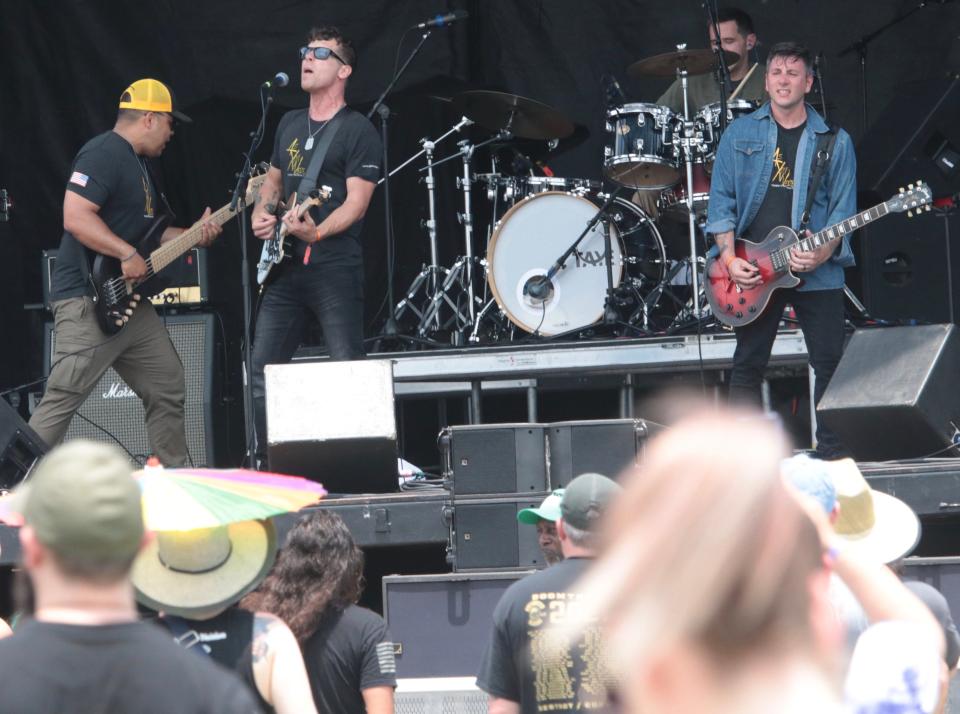 As You Were, a band of U.S. Army musicians based in Kentucky, take to the stage at Welcome to Rockville at Daytona International Speedway on the event's opening-day on Thursday.