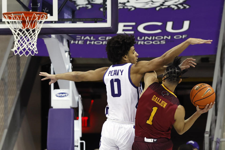 TCU guard Micah Peavy (0) defends as Louisiana-Monroe guard Savion Gallion (1) tries to shoot during the first half of an NCAA college basketball game Thursday, Nov. 17, 2022, in Fort Worth, Texas. (AP Photo/Ron Jenkins)