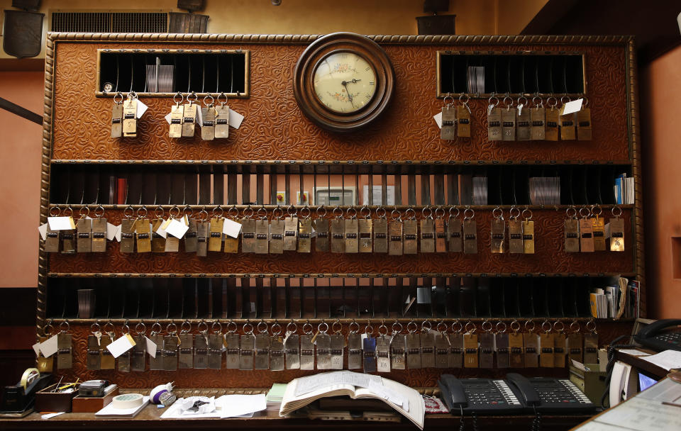 In this picture taken on Wednesday, May 13, 2020, keys hang at the reception of the Saturnia hotel, in Venice, Italy. Venetians are rethinking their city in the quiet brought by the coronavirus pandemic. For years, the unbridled success of Venice's tourism industry threatened to ruin the things that made it an attractive destination to begin with. Now the pandemic has ground to a halt Italy’s most-visited city, stopped the flow of 3 billion euros in annual tourism-related revenue and devastated the city's economy. (AP Photo/Antonio Calanni)