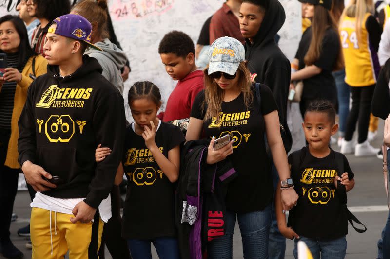 Mourners gather outside Staples Center before a Los Angeles Lakers home game to pay respects to Kobe Bryant