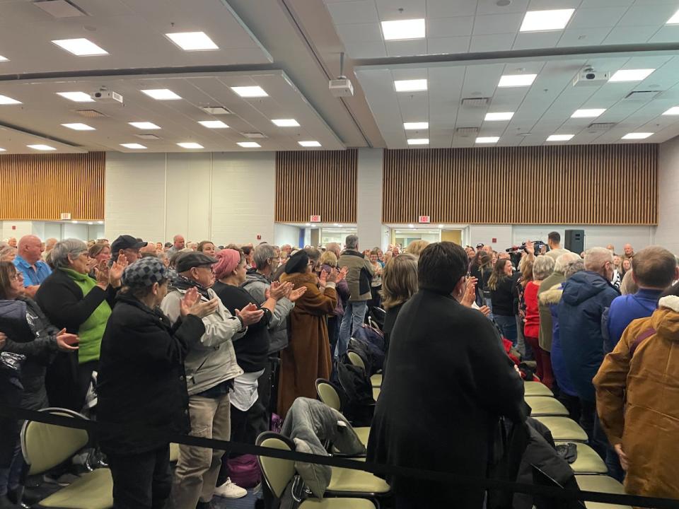 The crowd at the town hall gives PCH staff in attendance a standing ovation.