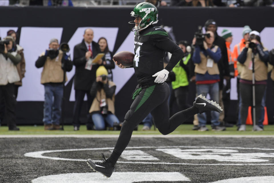 New York Jets quarterback Sam Darnold (14) rushes for a touchdown during the first half of an NFL football game against the New York Giants, Sunday, Nov. 10, 2019, in East Rutherford, N.J. (AP Photo/Bill Kostroun)