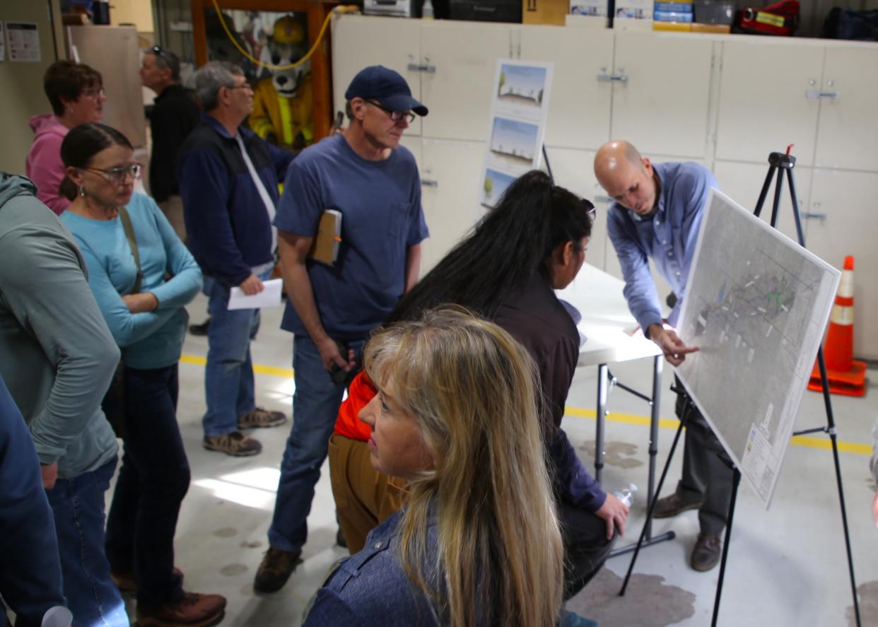 Nick Porell, right, San Juan County's public works director, discusses the proposed Lower Animas Valley Recreation Trail with residents during an open house event Thursday, May 9 at the Flora Vista Fire Station.