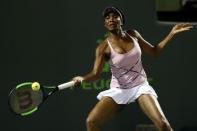 Mar 27, 2017; Miami, FL, USA; Venus Williams of the United States hits a forehand against Svetlana Kuznetsova of Russia (not pictured) on day seven of the 2017 Miami Open at Crandon Park Tennis Center. Williams won 6-3, 7-6(4). Mandatory Credit: Geoff Burke-USA TODAY Sports