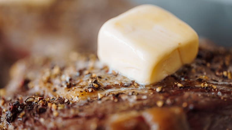 Butter melting on meat