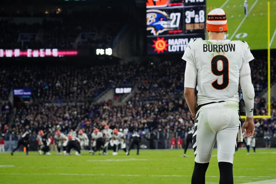 Bengals quarterback Joe Burrow watches from the sidelines Thursday against the Ravens.