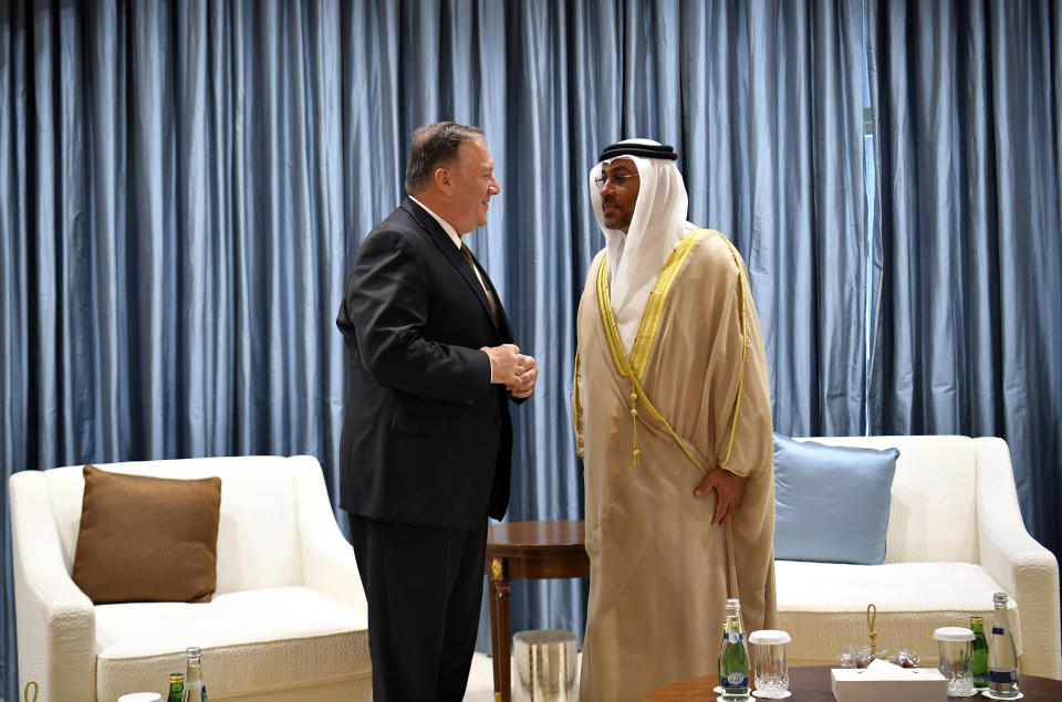 U.S. Secretary of State Mike Pompeo talks to United Arab Emirates Minister of State Ahmed al-Sayegh in Abu Dhabi, United Arab Emirates, Thursday, Sept. 19, 2019. (Mandel Ngan/Pool via AP)