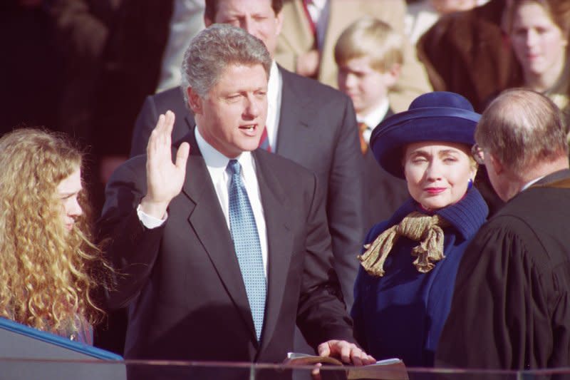 William Jefferson Clinton, flanked by his daughter, Chelsea Clinton, (L) and wife, Hillary Rodham Clinton, is sworn in as president of the United States as he takes the oath of office administered by Supreme Court Justice William Hubbs Rehnquist on January 20, 1993, on Capitol Hill. UPI File Photo