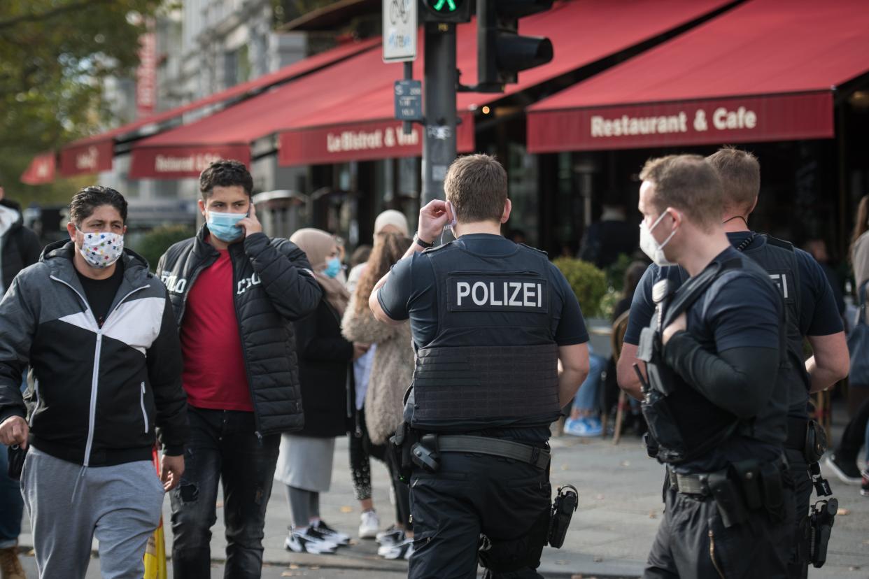 Police officers of the Federal Police patrol at Kurfuerstendamm (Ku'damm), a popular shopping street on October 24, 2020 in Berlin. - Measures to contain the coronavirus Covid-19 pandemic have been tightened and city authorities decided the requirement that people wear masks outside in busy commercial areas. (Photo by STEFANIE LOOS / AFP) (Photo by STEFANIE LOOS/AFP via Getty Images)