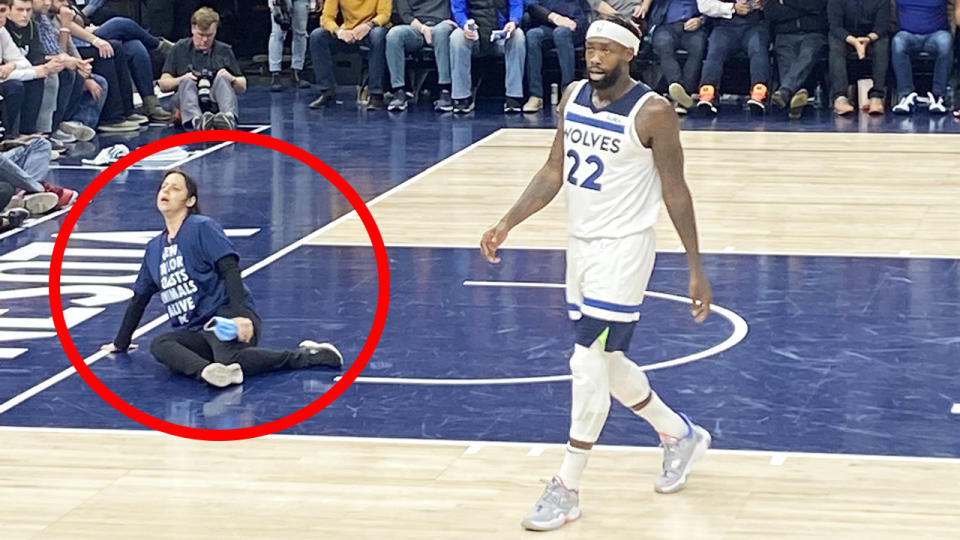 The NBA play-in game between Minnesota and the LA Clippers was briefly interrupted when a protestor attempted to glue themselves to the court during the first half. Picture: Twitter