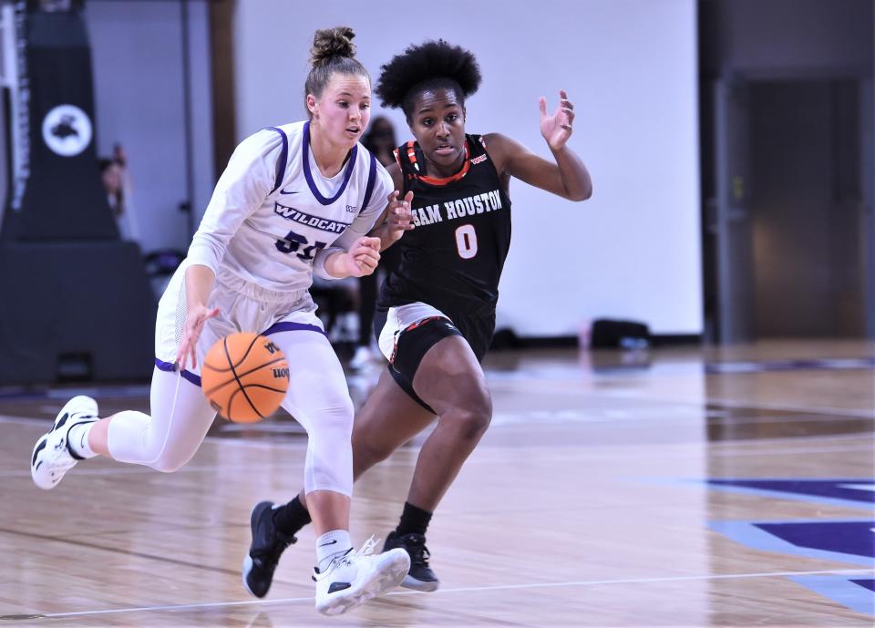 ACU's Madi Miller brings the ball up court as Sam Houston's Sydnee Kemp defends in the second half.