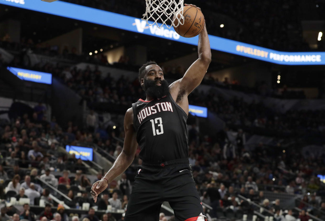 Houston Rockets guard James Harden (13) drives to the basket during the second half of an NBA basketball game against the San Antonio Spurs, in San Antonio, Tuesday, Dec. 3, 2019. San Antonio won 135-133 in double overtime. (AP Photo/Eric Gay)