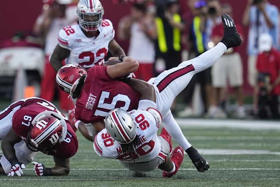 Indiana quarterback Brendan Sorsby (15) is sacked by Ohio State defensive tackle Jaden McKenzie (90) during the second half of an NCAA college football game, Saturday, Sept. 2, 2023, in Bloomington, Ind. (AP Photo/Darron Cummings)