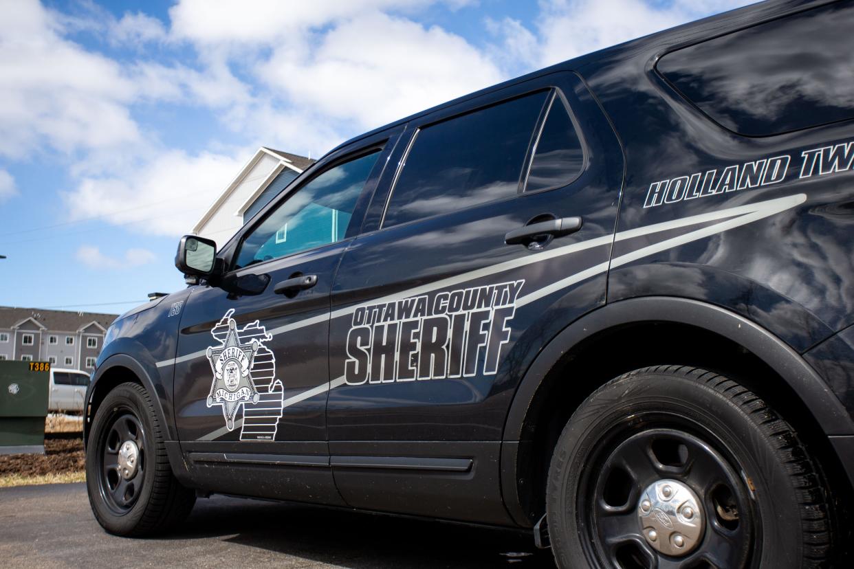 An Ottawa County Sheriff's car blocked the entrance to Falcon Woods Apartments Monday, March 28, 2022, near the corner of 120th Avenue and Felch Street in Holland Township. 