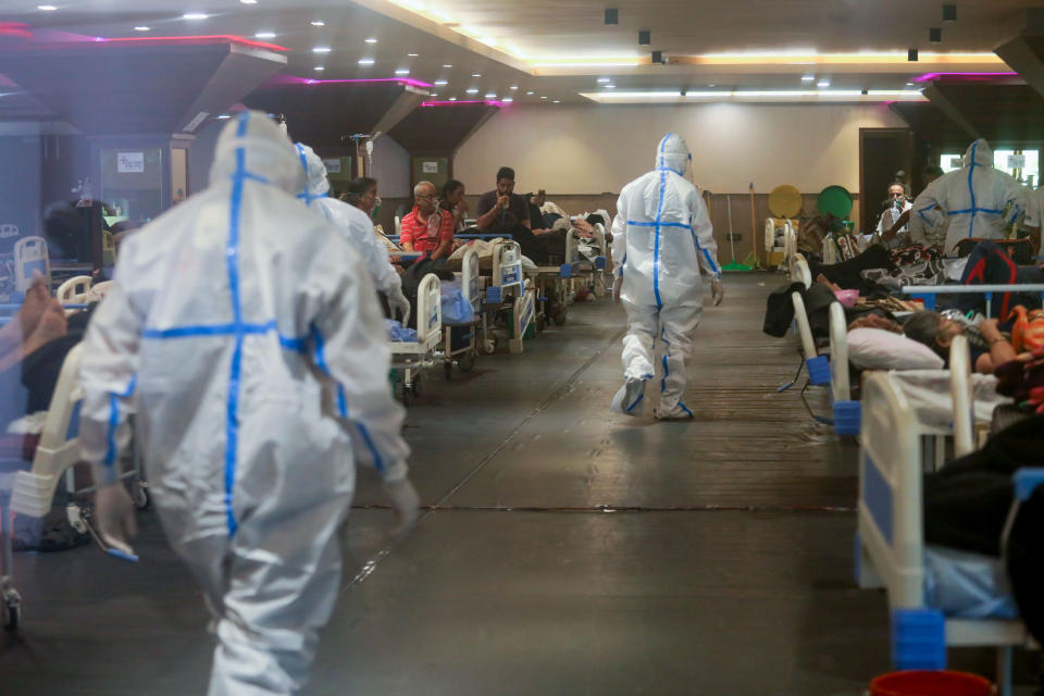  Healthcare workers in personal protective equipment (PPE) walk in the Covid-19 isolation ward.
A banquet hall temporarily converted to a Covid19 ward for coronavirus patients. India has recorded the highest single-day spike in coronavirus infection. The report recorded 352,991 new Covid-19 cases and 2,812 people deaths in the last 24 hours amid an oxygen crisis. (Photo by Naveen Sharma / SOPA Images/Sipa USA) 