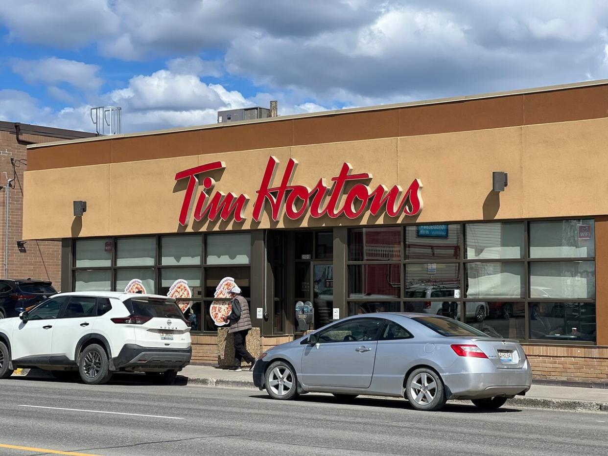 Tim Hortons on Second Avenue in Whitehorse. Owner Doug Terry, who relies on the Yukon Nominee Program to fill his staffing needs, says 'there was no heads-up whatsoever' on the program's pause.  (George Maratos/CBC - image credit)