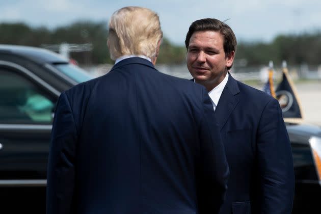 Florida Gov. Ron DeSantis (R) greets then-President Donald Trump in Fort Myers, Florida, in October 2020. DeSantis seemingly aims to argue that he'd be a better president than Trump without attacking him.