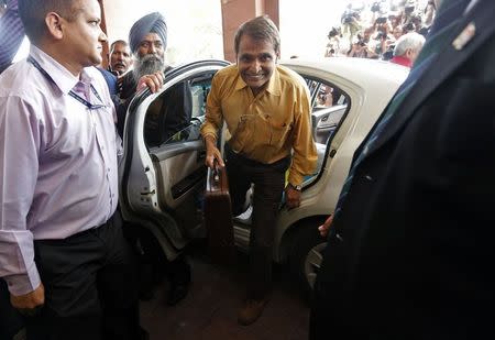 Railway Minister Suresh Prabhu (C) arrives at the parliament to unveil the railway budget in New Delhi February 26, 2015. REUTERS/Adnan Abidi