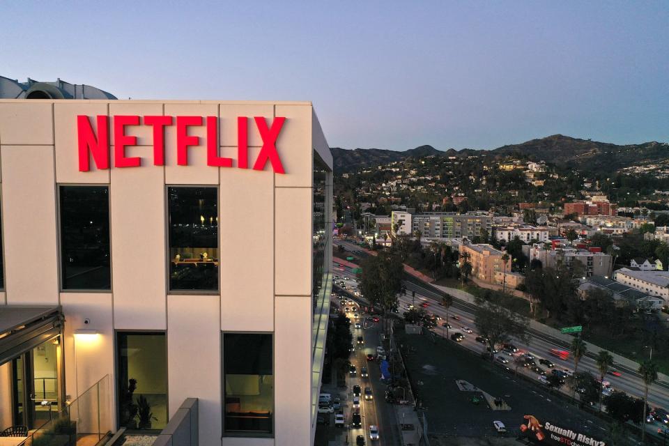 The Netflix logo is seen on top of their office building in Hollywood, California, January 20, 2022. - Netflix on Thursday reported cooling subscriber growth as fierce competition and the pandemic weigh heavy despite hits like "Squid Game" and "Money Heist."
The streaming service ended the year with 221.8 million subscribers, just below target, after booming during coronavirus lockdowns that kept people at home and on the platform. (Photo by Robyn Beck / AFP) (Photo by ROBYN BECK/AFP via Getty Images)