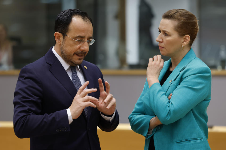 Cypriot President Nikos Christodoulides, left, talks to Denmark's Prime Minister Mette Frederiksen during a round table meeting at an EU summit in Brussels, Thursday, Feb. 1, 2024. European Union leaders meet in Brussels for a one day summit to discuss the revision of the Multiannual Financial Framework 2021-2027, including support for Ukraine. (AP Photo/Geert Vanden Wijngaert)