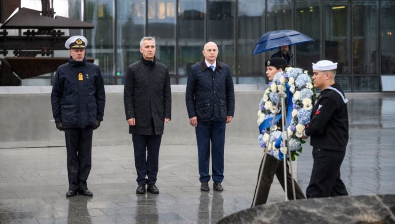 (L-R) Chair NATO Military Committee, Admiral Rob Bauer, NATO Secretary General Jens Stoltenberg and NATO Deputy Secretary General Mircea Geoana attend a laying wreath ceremony in memory of military personnel of NATO countries killed in service. -/NATO/dpa