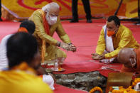 Indian Prime Minister Narendra Modi performs the groundbreaking ceremony of a temple dedicated to the Hindu god Ram, in Ayodhya, India, Wednesday, Aug. 5, 2020. The coronavirus is restricting a large crowd, but Hindus were joyful before Prime Minister Narendra Modi breaks ground Wednesday on a long-awaited temple of their most revered god Ram at the site of a demolished 16th century mosque in northern India. (AP Photo/Rajesh Kumar Singh)