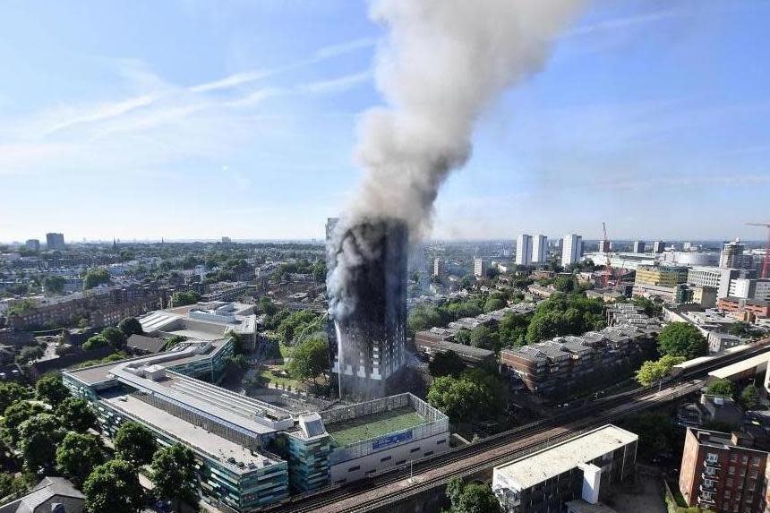 Smoke rises from Grenfell Tower after a deadly fire engulfed the 24-storey residential block in west London: Getty Images