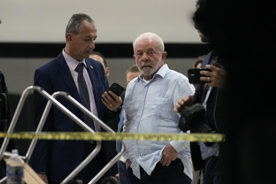 Brazil's President Luiz Inacio Lula da Silva walks in Planalto Palace after it was stormed by supporters of Brazil's former President Jair Bolsonaro in Brasilia, Brazil, Sunday, Jan. 8, 2023. (AP Photo/Eraldo Peres)