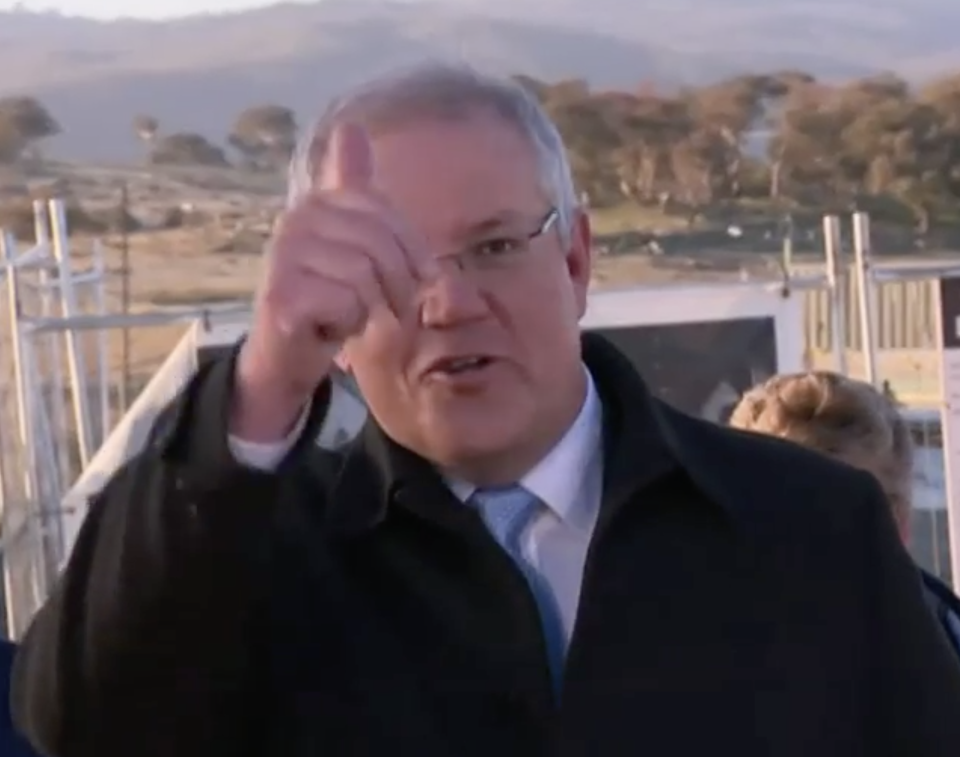 Scott Morrison gestured a thumbs up after successfully getting everyone off the lawn.  Source: Sky News