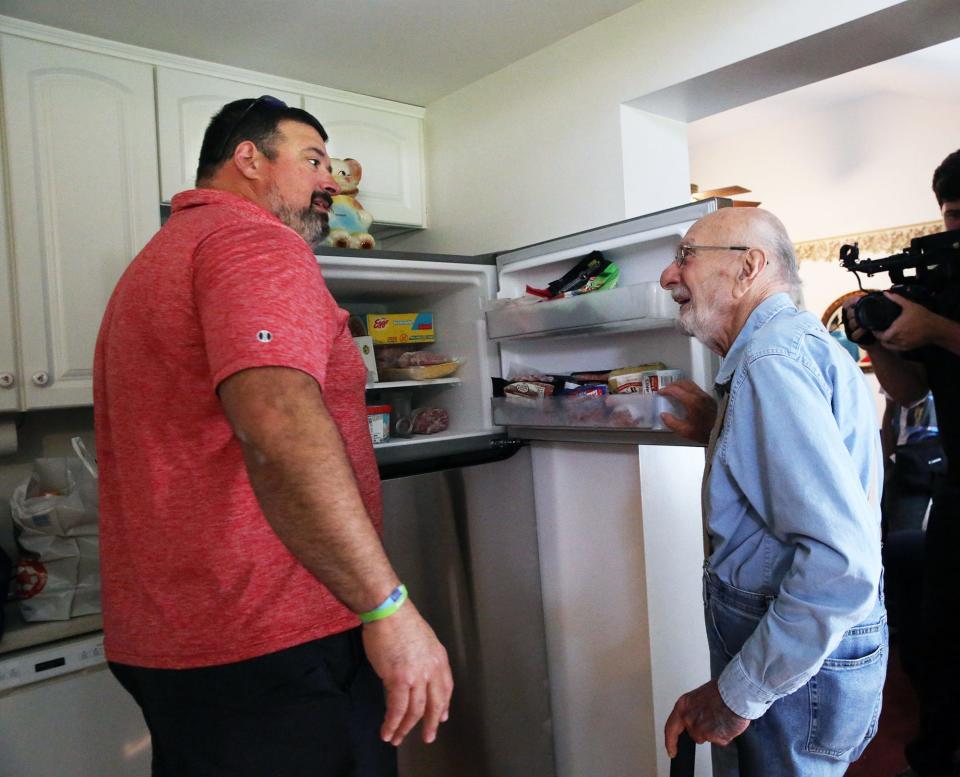 Former New England Patriots offensive lineman and three-time Super Bowl champion Joe Andruzzi met up with and delivered groceries to Rudy Longo, a 91-year-old leukemia and prostate cancer patient, to his Stratham house Wednesday, Sept. 13, 2023.